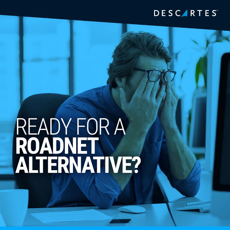 Frustrated man at desk places hands on his face