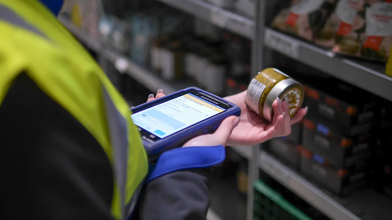 Warehouse Worker Scanning Product Barcode