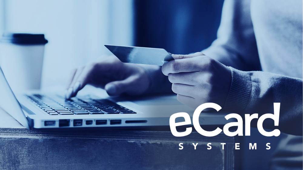 eCard Systems logo with photo of person holding a gift card and typing on a laptop computer
